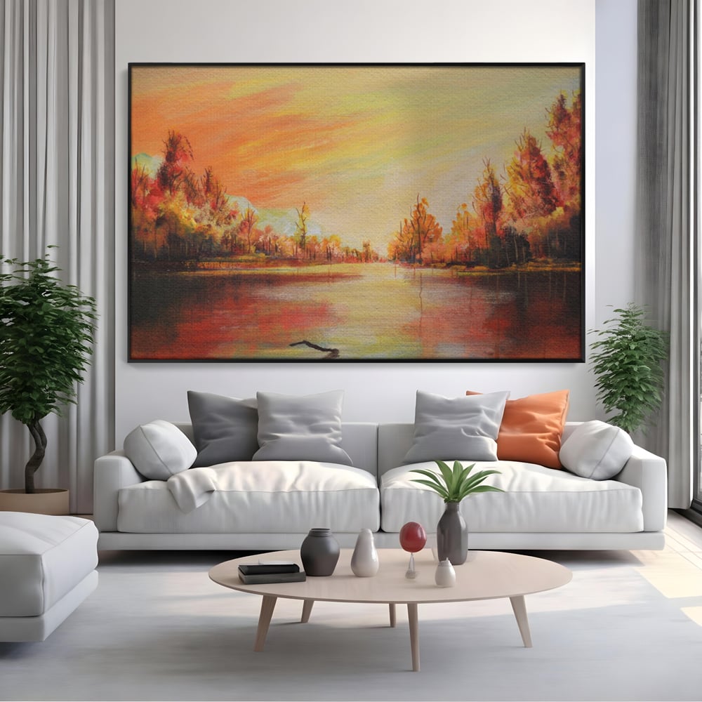 Tablou canvas cu pictura cu peisaj de toamna si lac, in rama de aluminiu negru, pe perete intr-un living